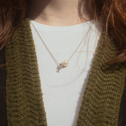 Sisyphus Necklace worn on female model