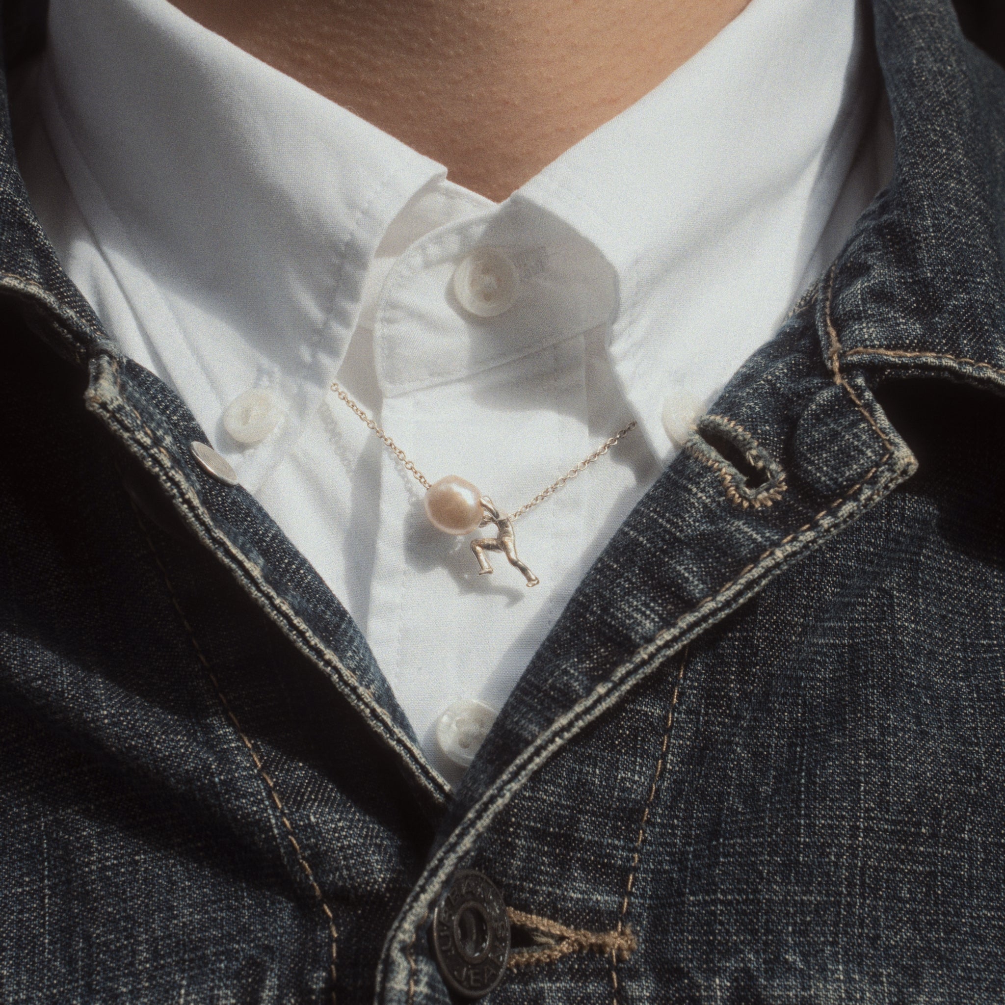 Sisyphus Necklace worn on male model